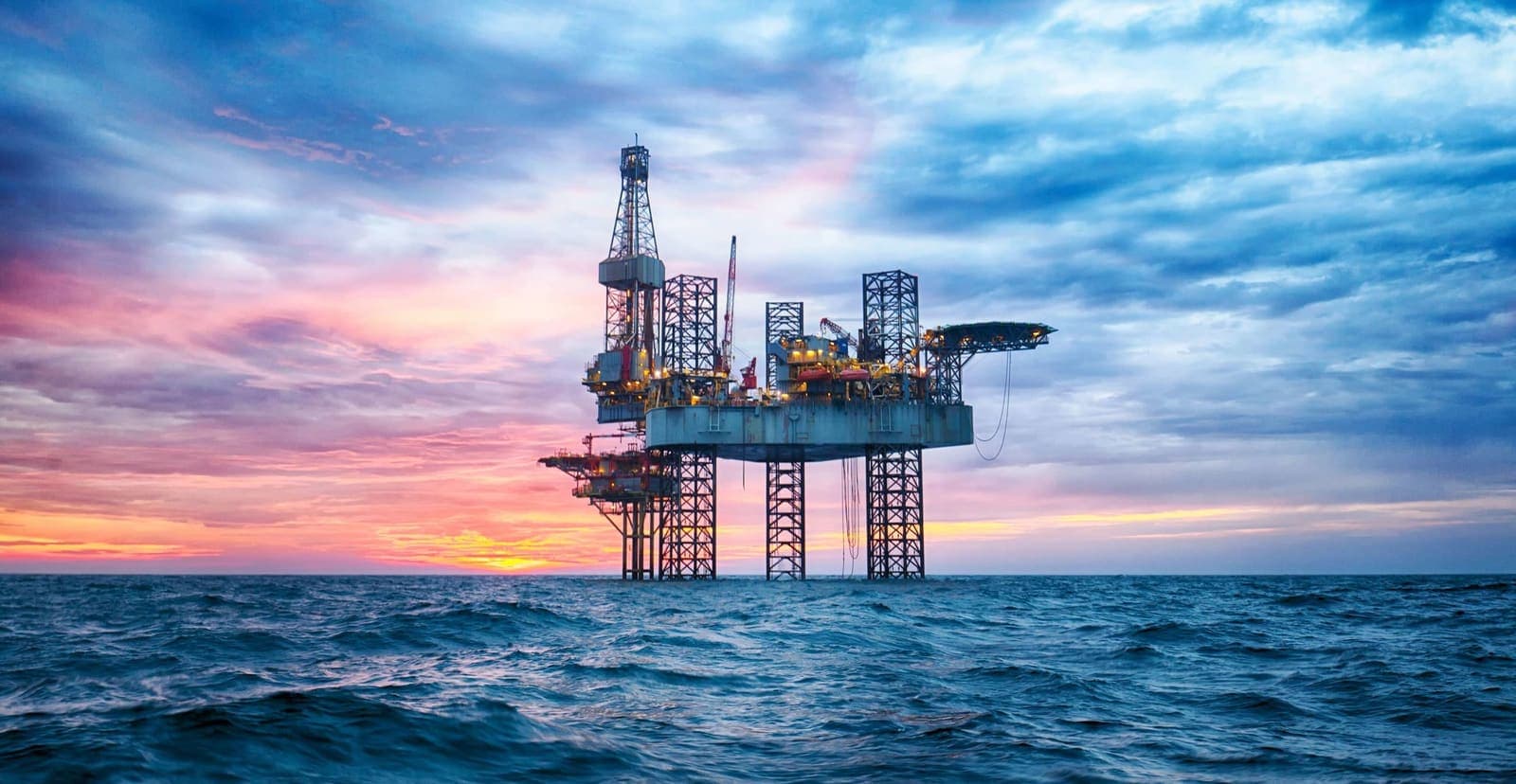 Offshore jack-up rig at sunset