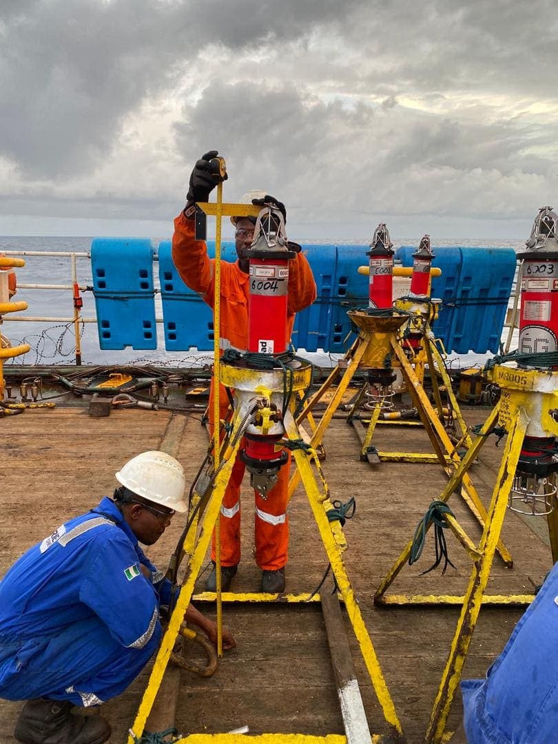 Geoace surveyor deploying LBL beacons from a survey vessel