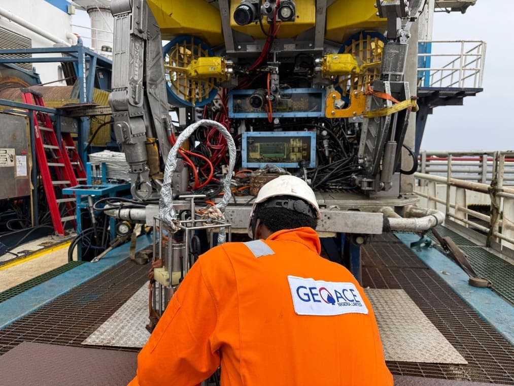 Geoace technician working on ROV equipment aboard a survey vessel